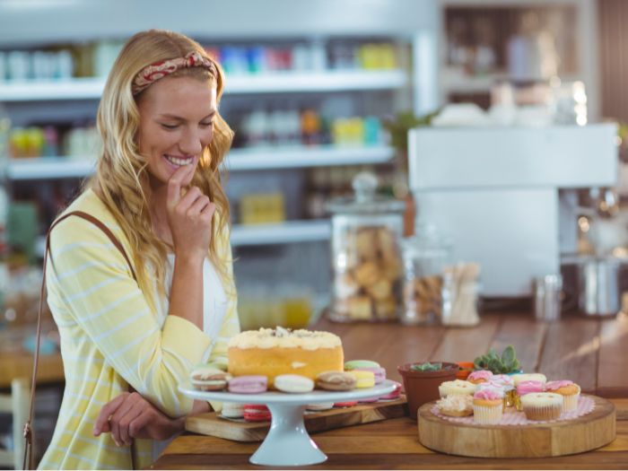 Woman selecting cakes